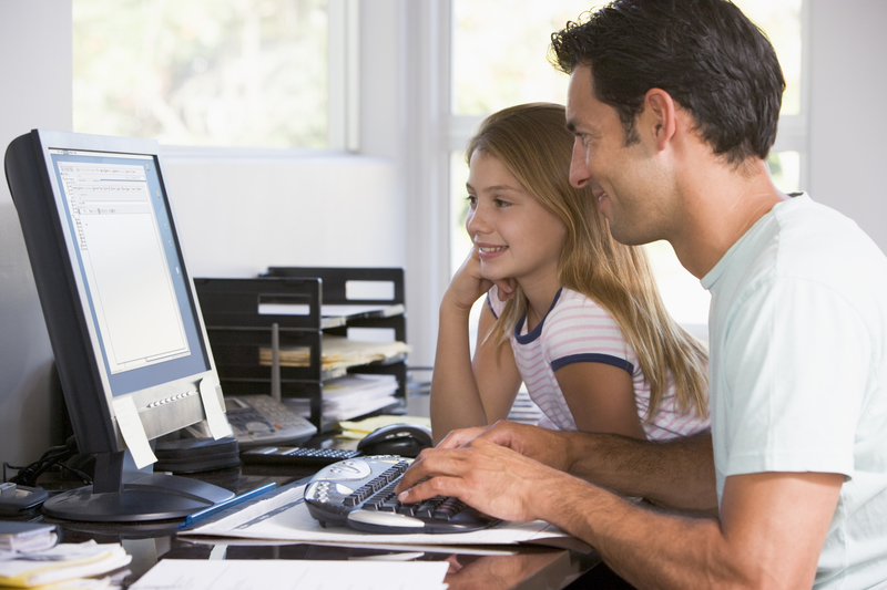 Girl with dad and computer